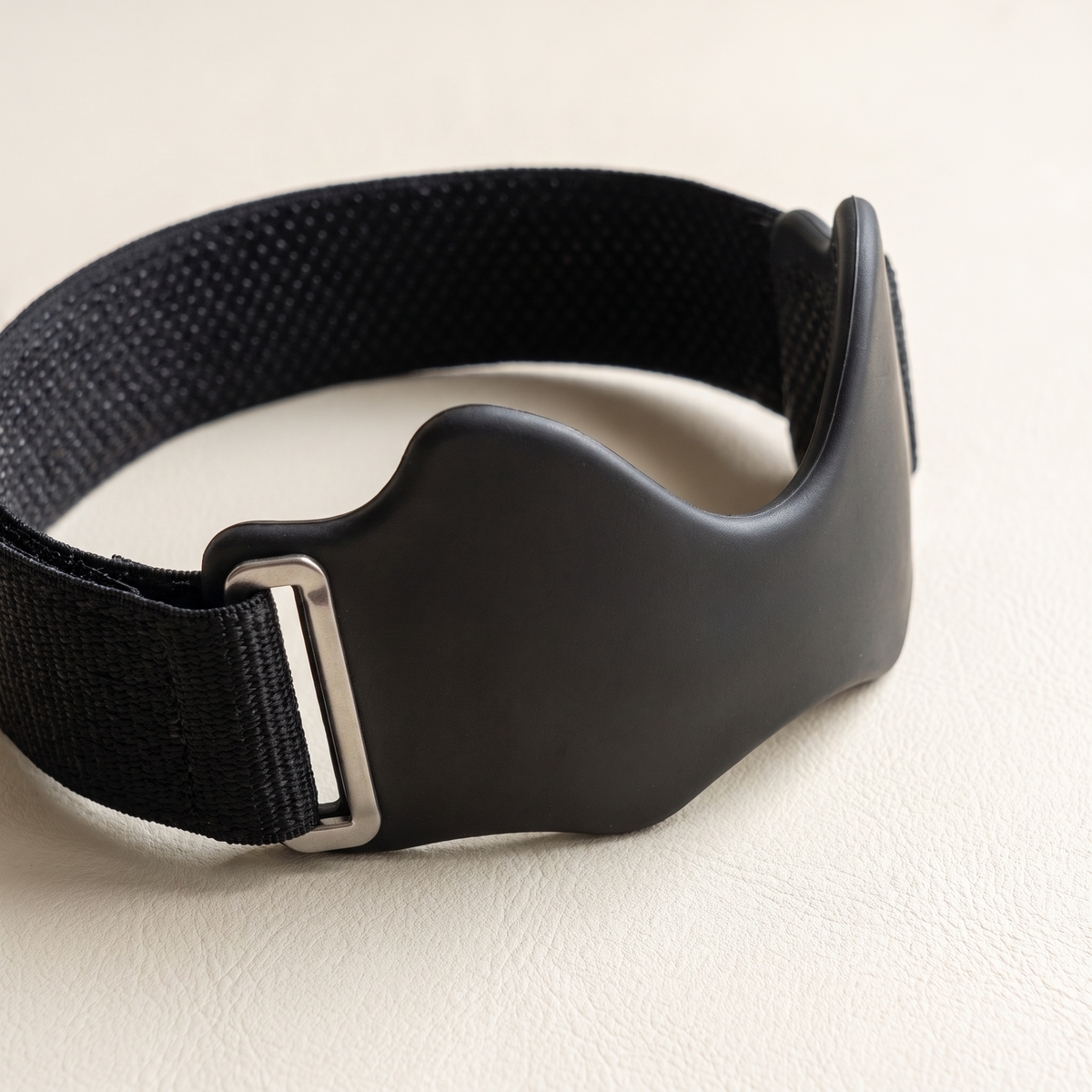 Close-up of the strap's silicone grip, support pad and adjustable fastener
